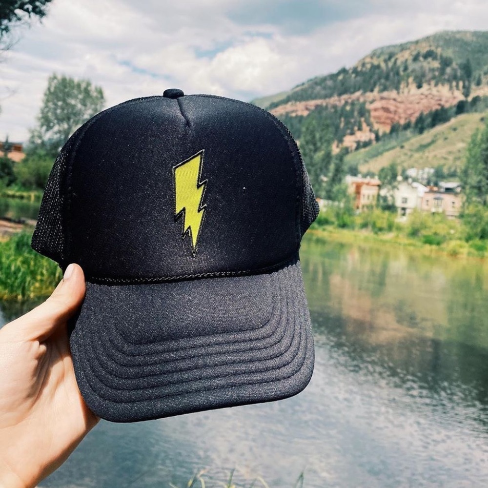 “happy hats” black trucker hat with patch
